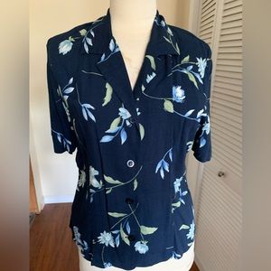 Tropical looking, navy, floral rayon blouse, in excellent condition.